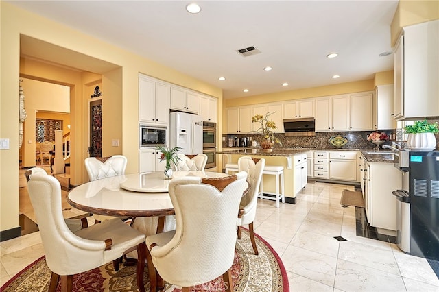 dining space with sink