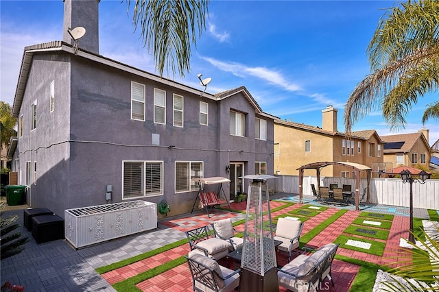 back of house with a patio