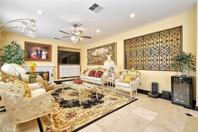 living room with ceiling fan and beverage cooler