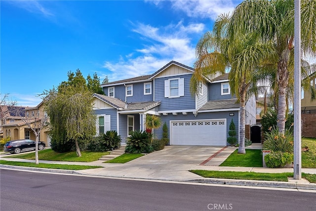 view of front of home featuring a front yard and a garage