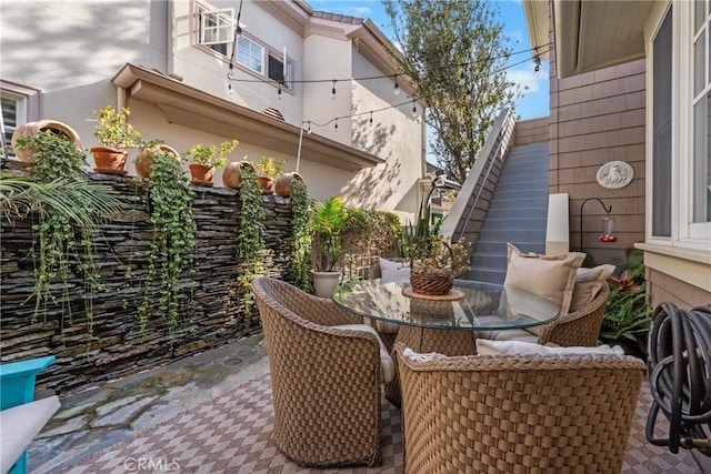 view of patio / terrace with stairs and outdoor dining area