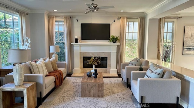 living area featuring recessed lighting, a fireplace, and crown molding