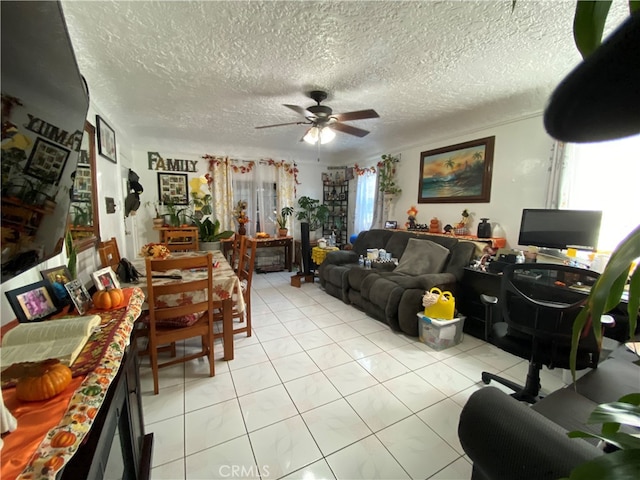 tiled living room featuring a textured ceiling and ceiling fan