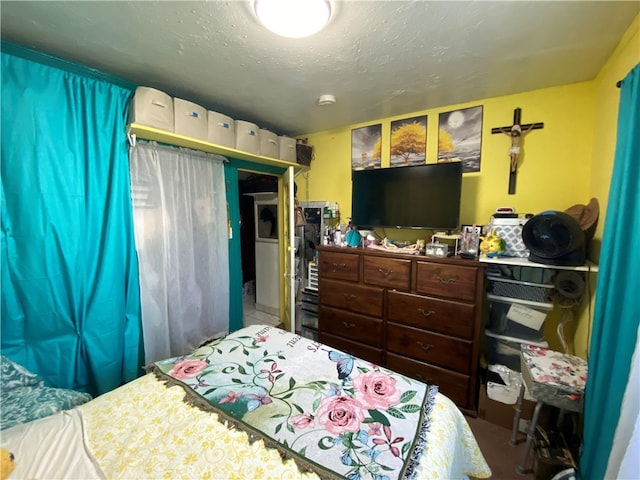 bedroom featuring a textured ceiling and a closet