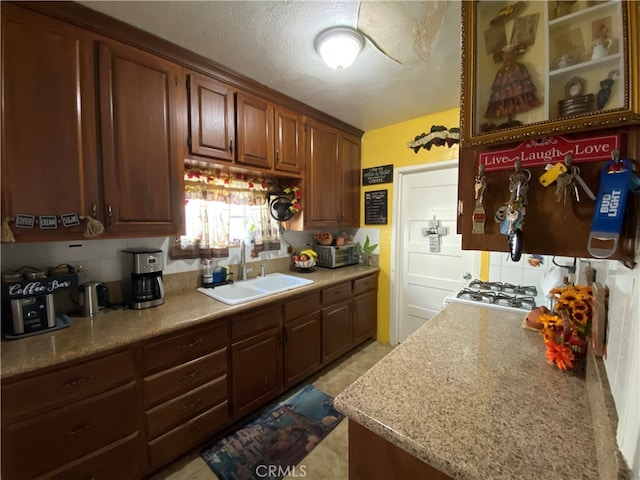 kitchen with sink and a textured ceiling