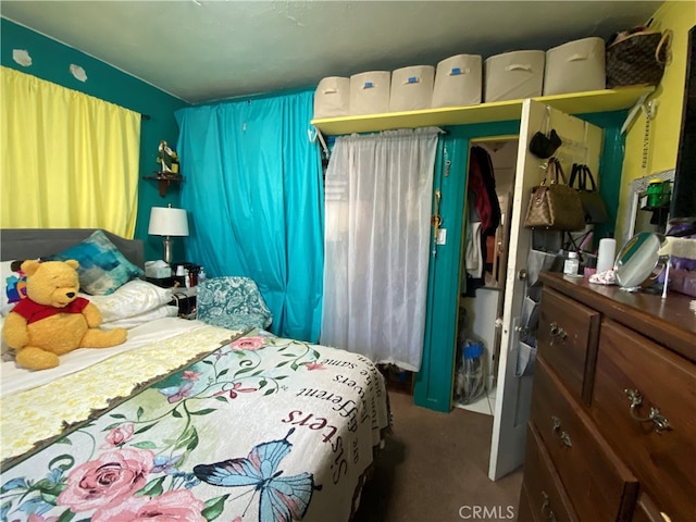 carpeted bedroom with a closet