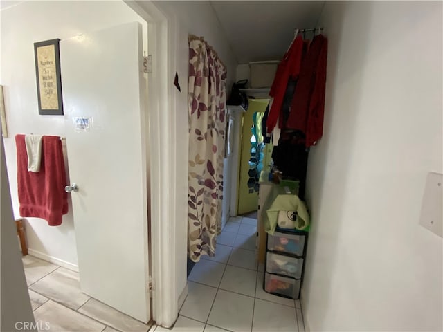 corridor with light tile patterned floors