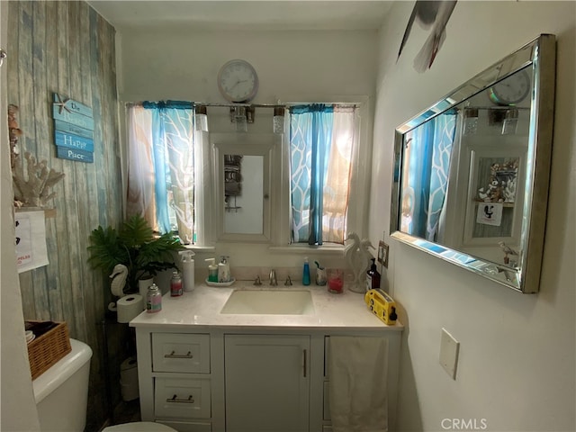 bathroom with vanity and toilet