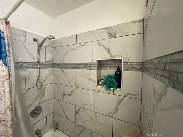 bathroom featuring shower / bathtub combination with curtain