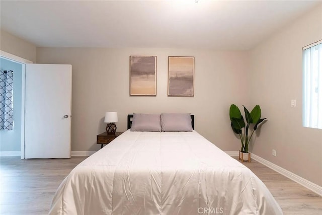 bedroom with light hardwood / wood-style floors