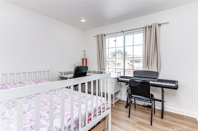 bedroom with hardwood / wood-style floors