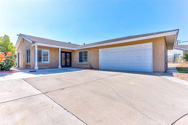 single story home with french doors and a garage