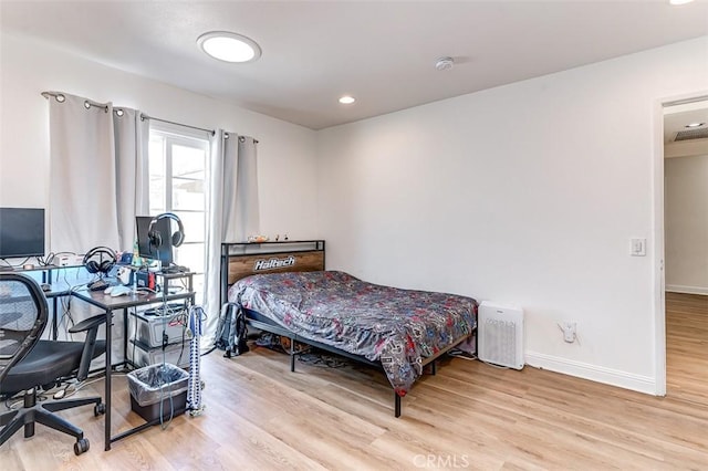 bedroom with light hardwood / wood-style flooring