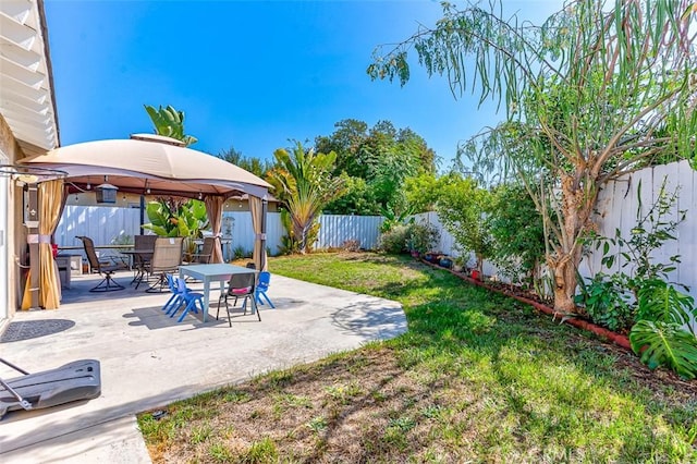 view of yard featuring a gazebo and a patio area