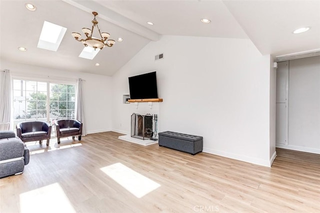 living room featuring high vaulted ceiling, a skylight, light hardwood / wood-style flooring, beam ceiling, and a chandelier