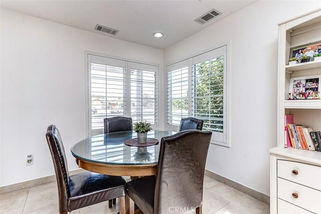 dining space featuring light tile patterned floors