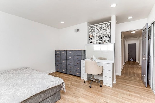 bedroom with light hardwood / wood-style floors