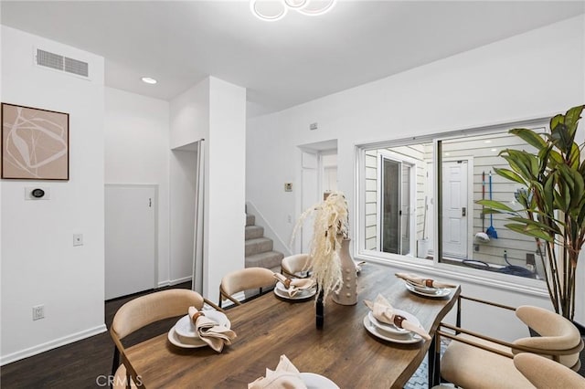 dining space with dark hardwood / wood-style flooring