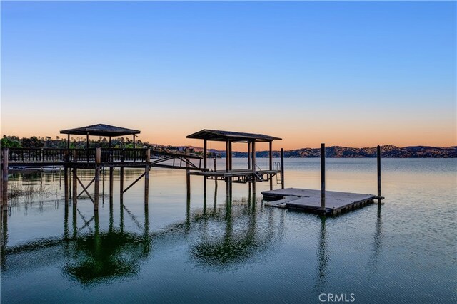 view of dock with a water view