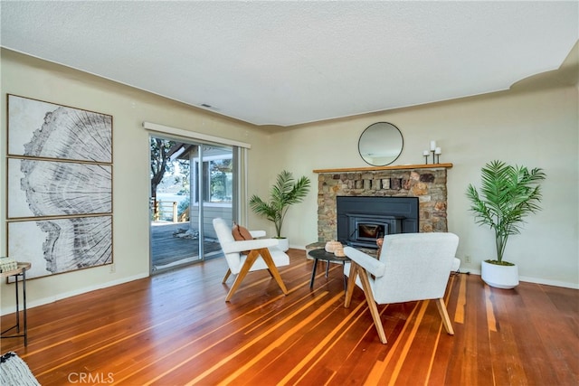 sitting room featuring hardwood / wood-style floors and a textured ceiling