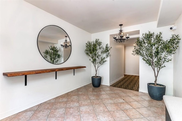 hallway featuring an inviting chandelier