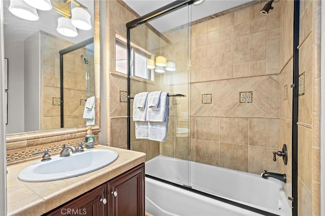 bathroom with vanity and combined bath / shower with glass door