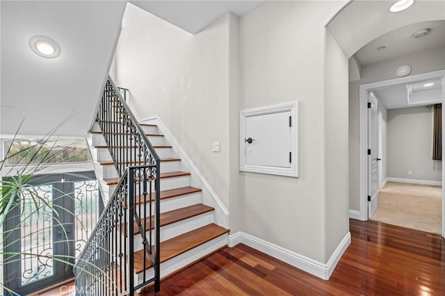 stairs with wood-type flooring