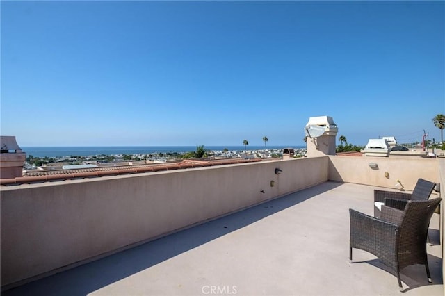 view of patio / terrace featuring a water view