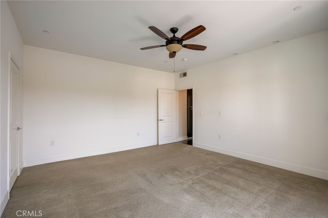 carpeted empty room with ceiling fan