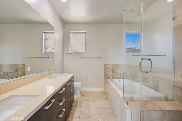 full bathroom with toilet, plus walk in shower, vanity, and tile patterned flooring