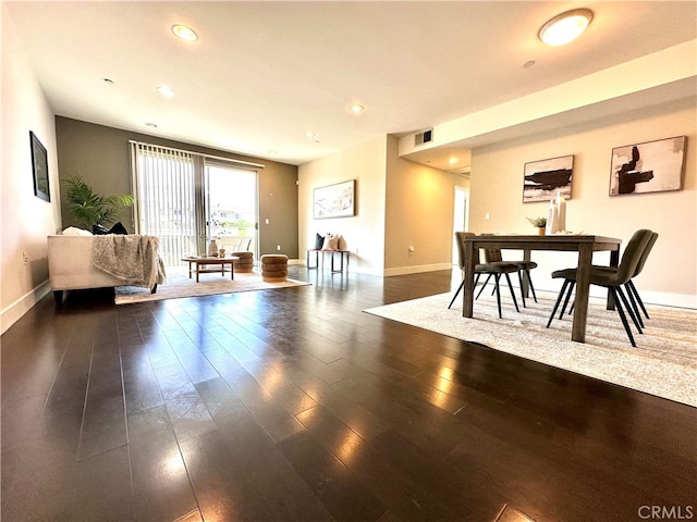 dining area featuring dark hardwood / wood-style floors