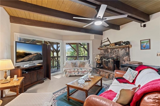 living room with beamed ceiling, ceiling fan, wood ceiling, and a fireplace