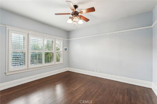 unfurnished room featuring ceiling fan and dark hardwood / wood-style flooring