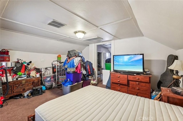 bedroom featuring carpet floors and vaulted ceiling