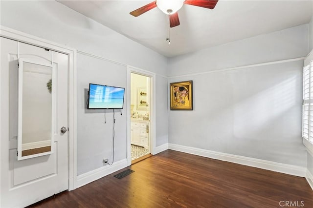 foyer entrance with hardwood / wood-style floors, ceiling fan, and a healthy amount of sunlight