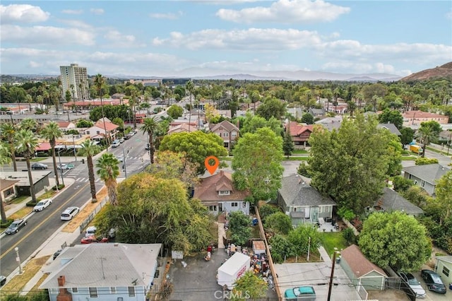 birds eye view of property featuring a mountain view