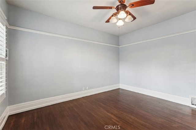 empty room with ceiling fan and dark wood-type flooring