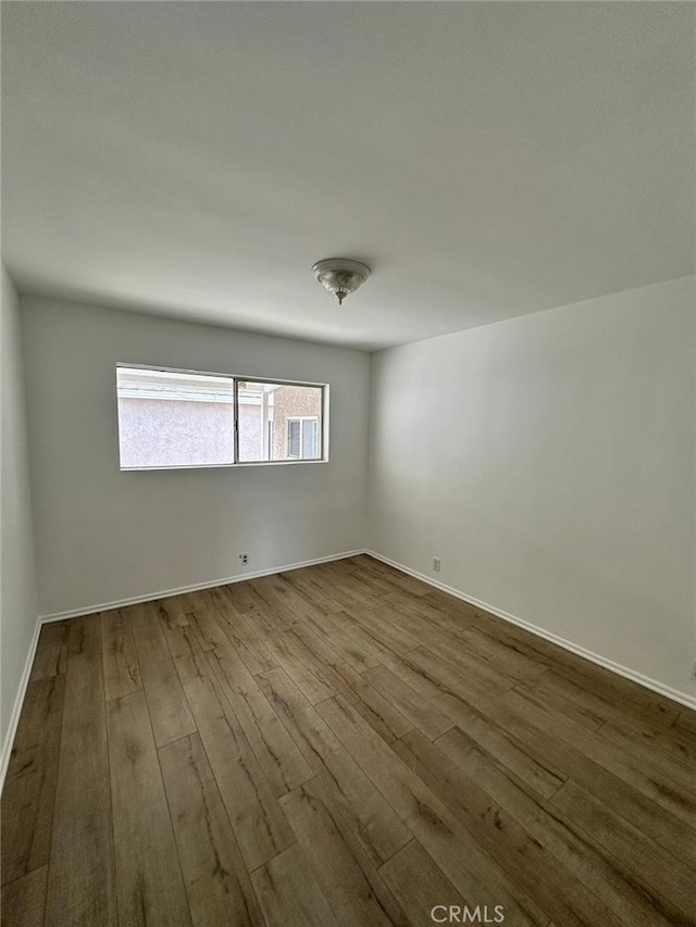 unfurnished room featuring light wood-type flooring