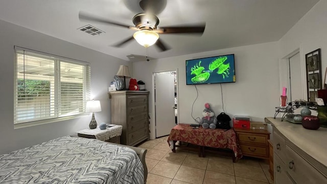 bedroom with light tile patterned flooring and ceiling fan