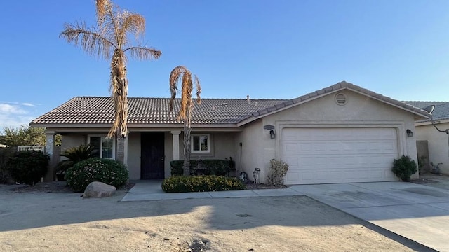 ranch-style house featuring a garage