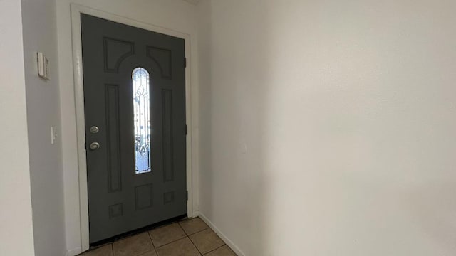 entryway featuring light tile patterned floors