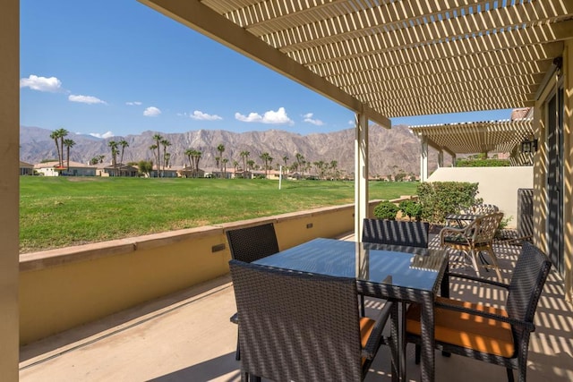 view of patio with a mountain view and a pergola