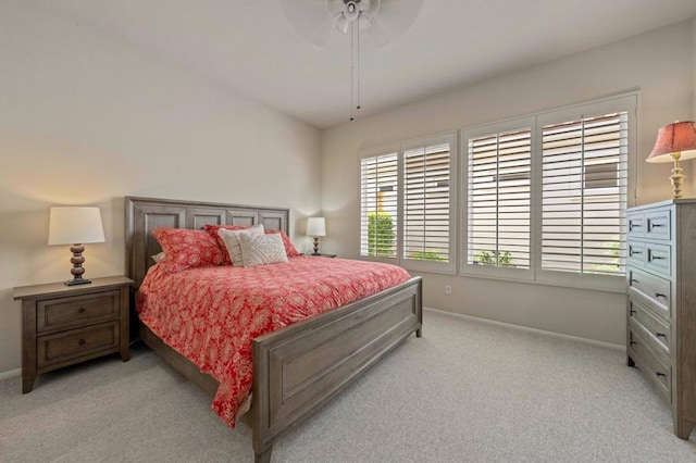 bedroom featuring ceiling fan and light colored carpet