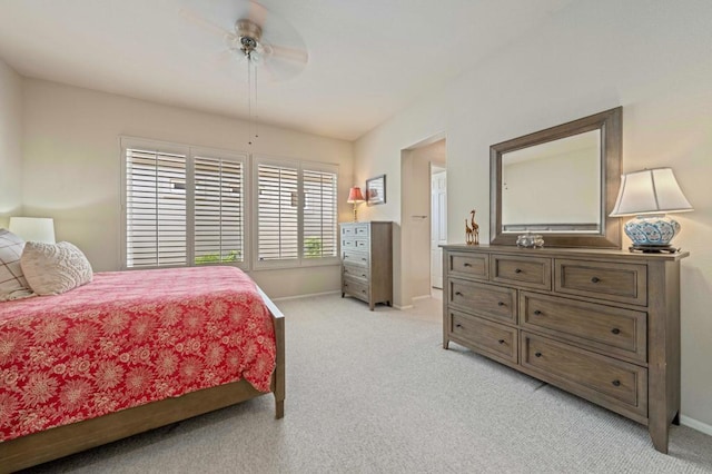 bedroom featuring ceiling fan and light carpet