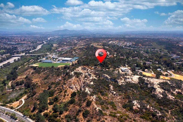 birds eye view of property featuring a mountain view