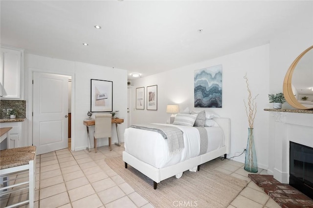 bedroom with light tile patterned floors