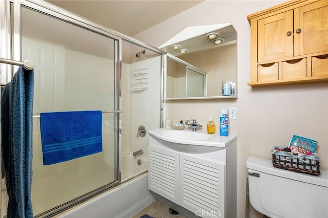 full bathroom featuring tile patterned flooring, vanity, toilet, and enclosed tub / shower combo