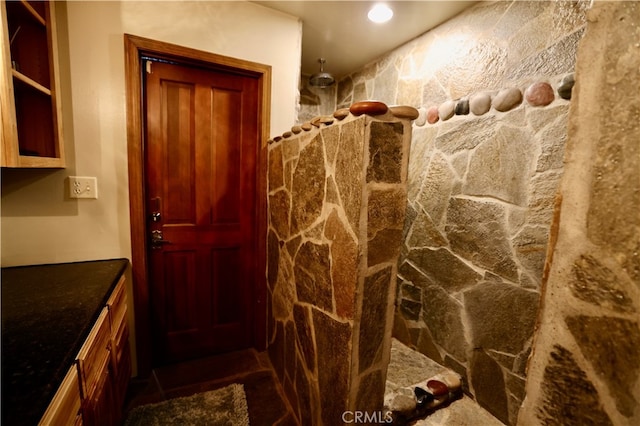 bathroom featuring walk in shower