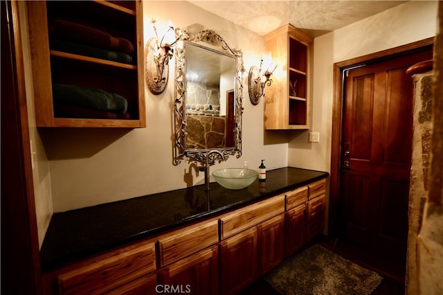 bathroom featuring vanity and a textured ceiling