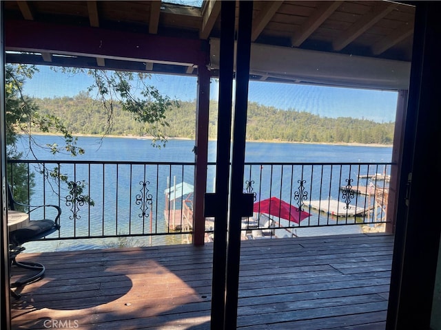 wooden terrace with a water view